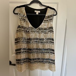 Bold sequin top, beige black top covered with sequins.